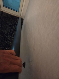 Railing came off wall causing stumble.