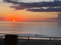 Watching the sunrise while sitting on the balcony