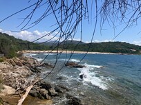 The rocky beach down the steps from the property