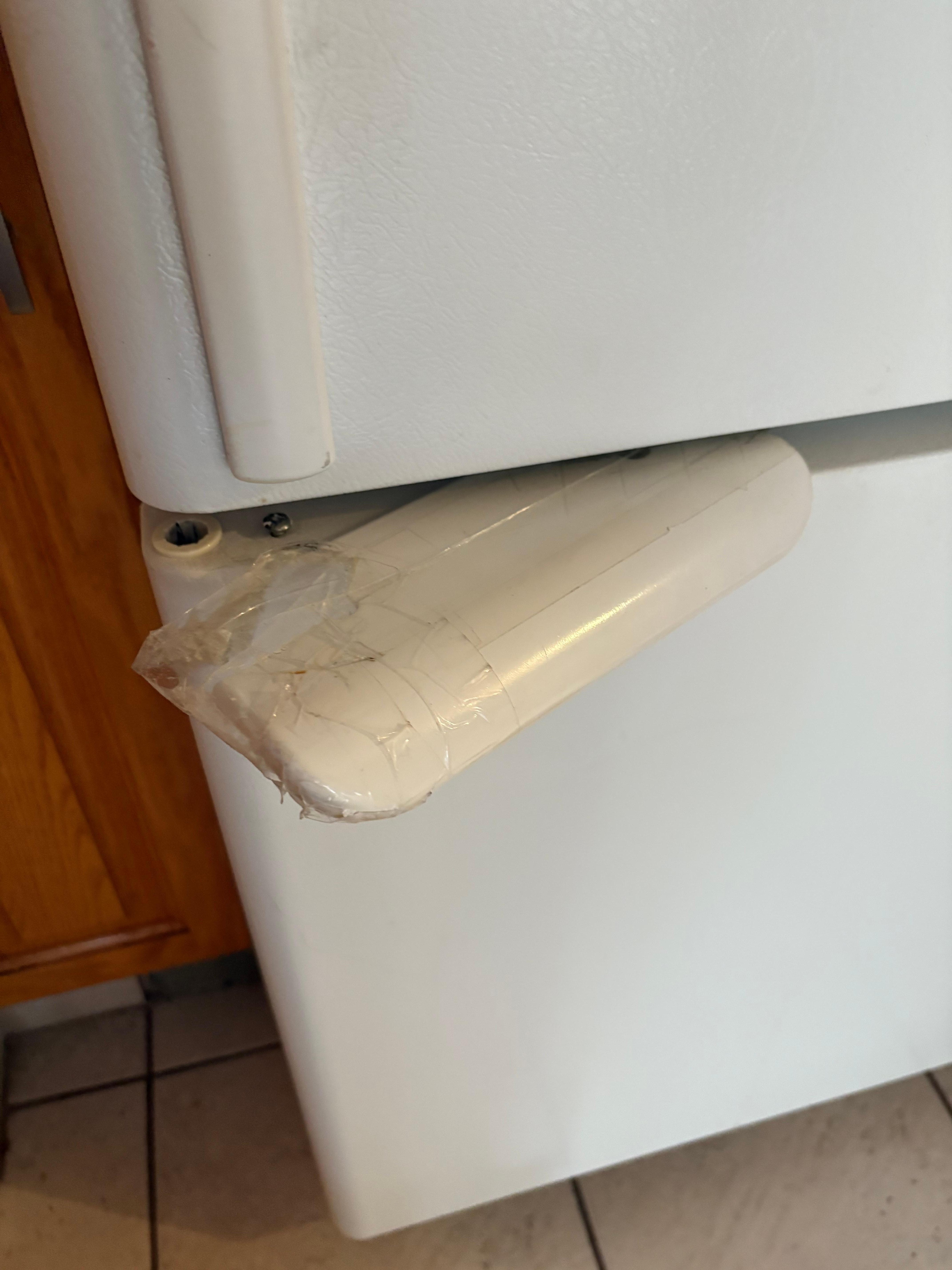 Freezer handle held together by tape