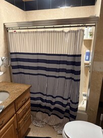 Hallway bathroom. Does not look like the photos in the listing at all.