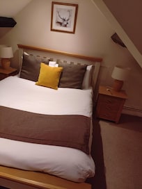 Spiral staircase and low ceilings to this comfortable bed