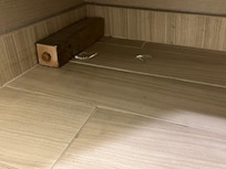 Glass shards on the bathroom floor