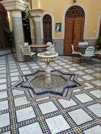 The fountain gently bubbling in the courtyard. There was a small pool as well, but we did not use it.