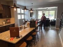 Kitchen, dining and front room gathering area