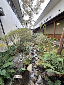 Tranquil garden path leads to Onsen.