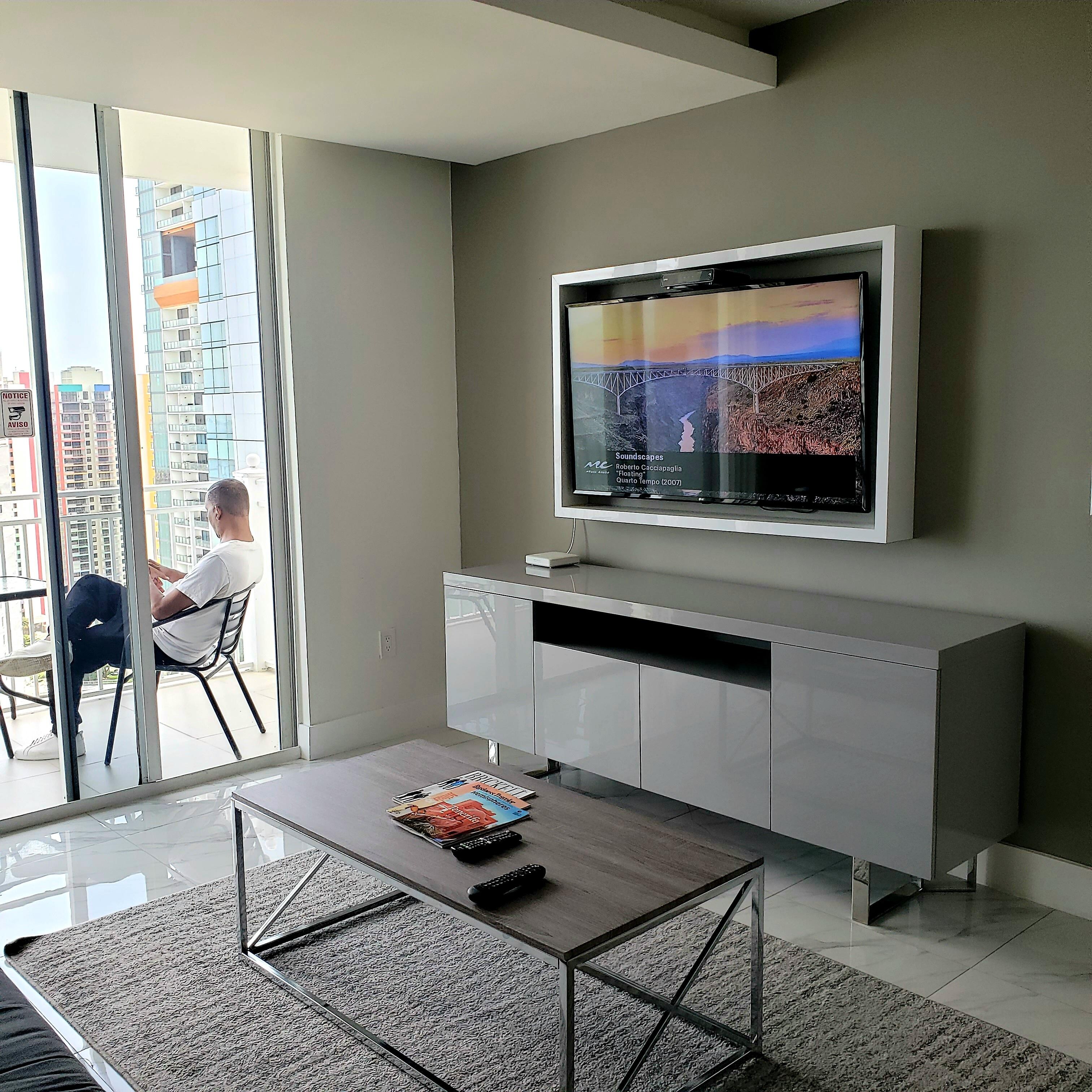 Partial view of Penthouse Living Room and terrace. There are a total of 3 TV's in this suite.