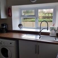 The kitchen with washing machine