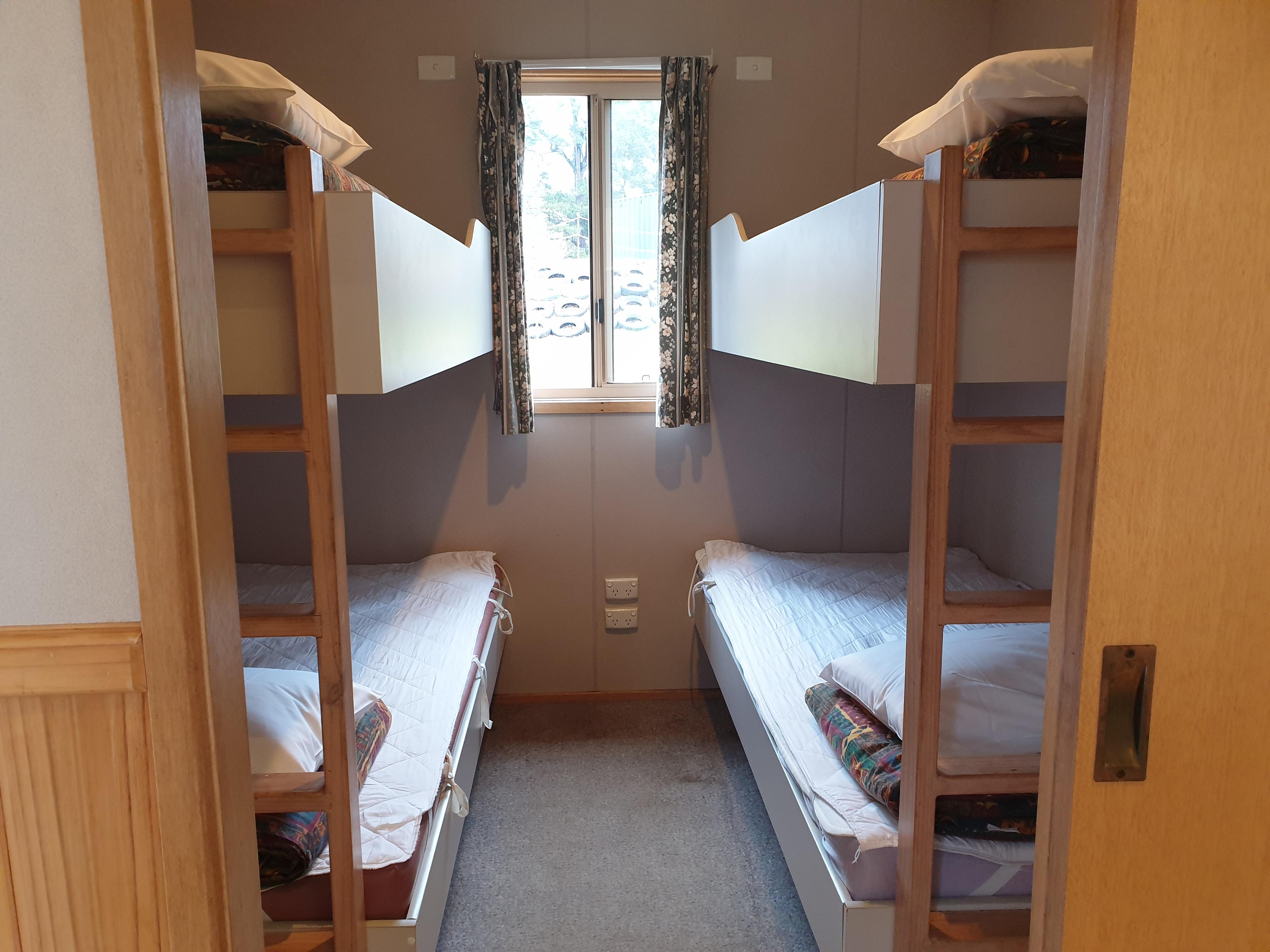 Bunk beds in one room, other bedroom has a double bed