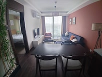 View from kitchen into living room and bedroom