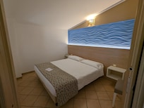 Separates Schlafzimmer in der Junior Suite Stromboli