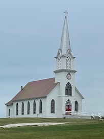 Church directly behind hotel.