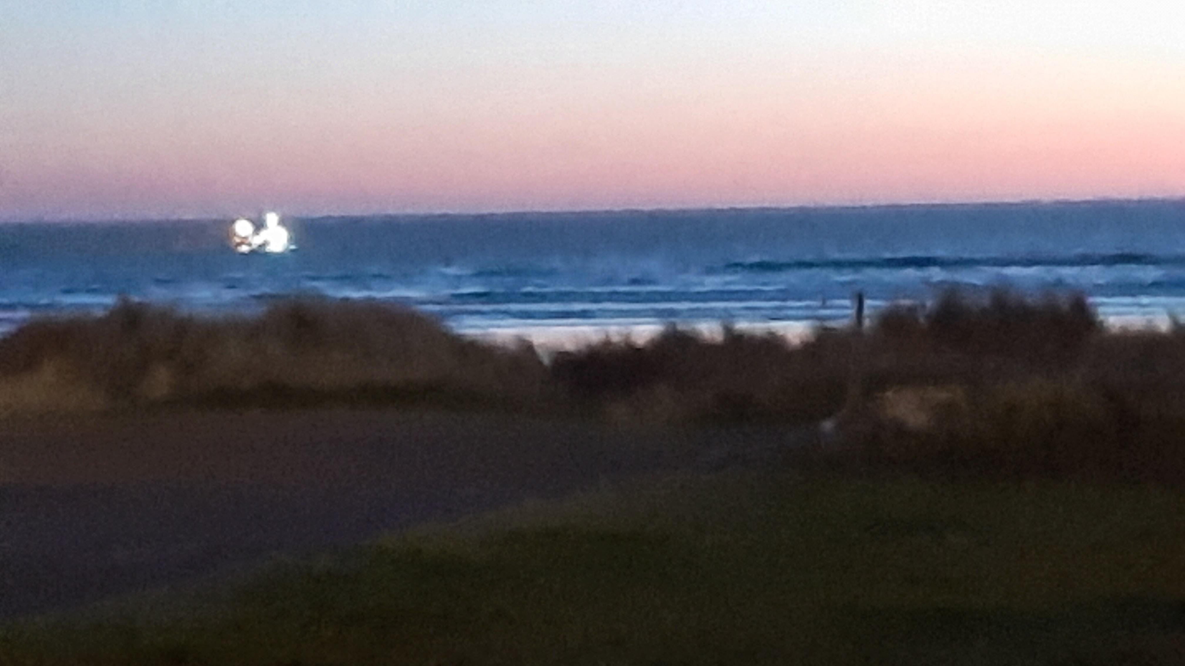 From our motel room, we could see a fishing boat come closer to shore for the night.
