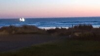 From our motel room, we could see a fishing boat come closer to shore for the night.