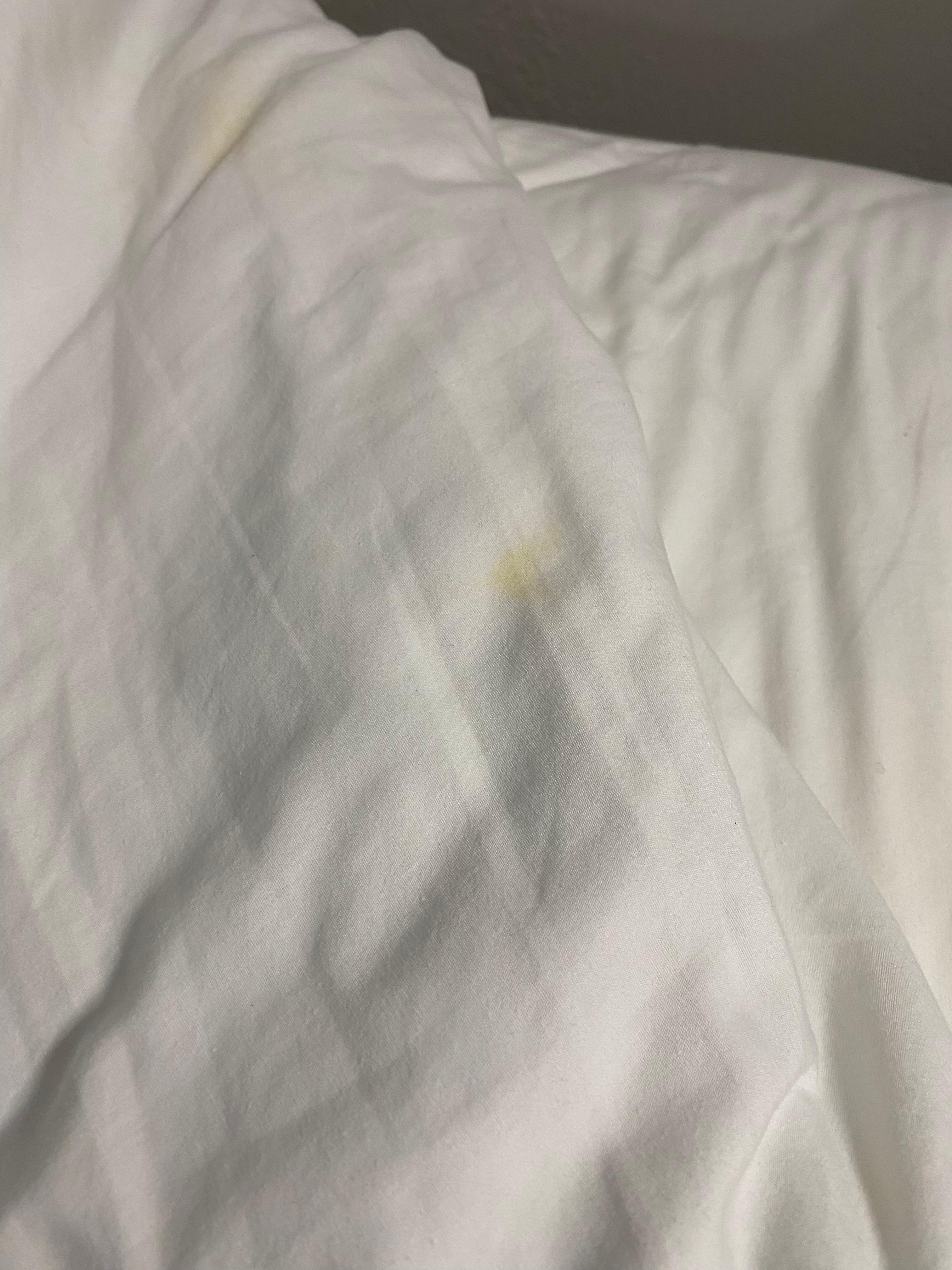 Stains on top of bed 