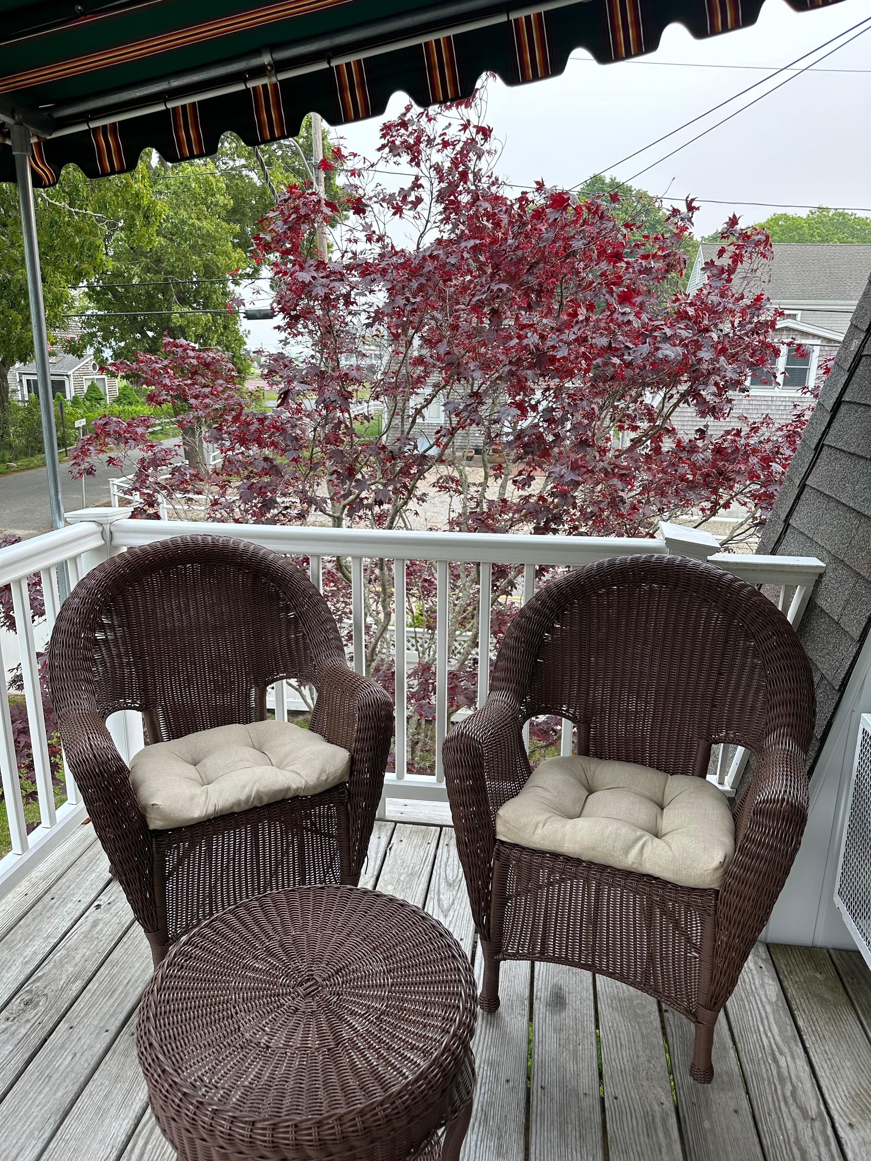 Second larger balcony (partial picture as not showing 3rd chair & stairway to yard).
