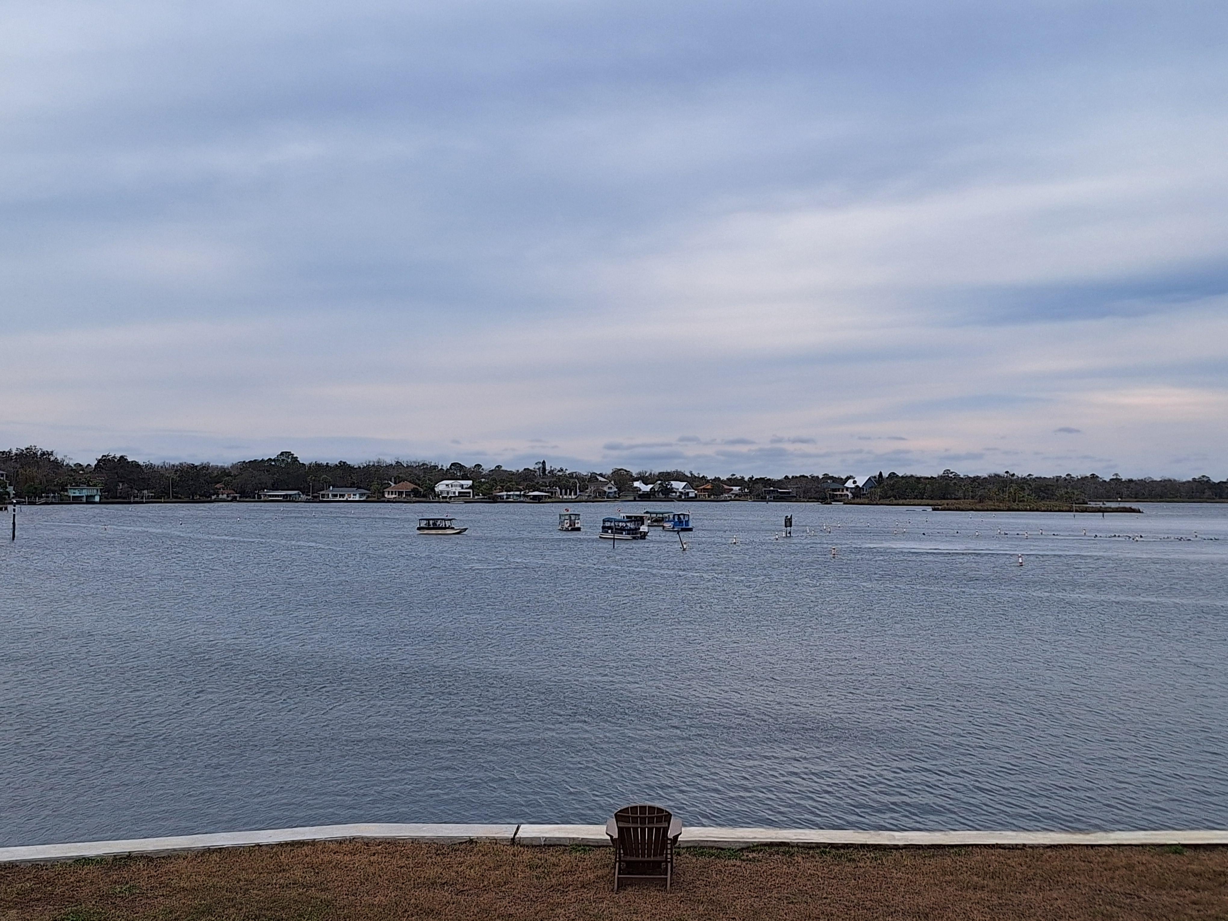 Watching the boats and swimmers seeking the manatees. 