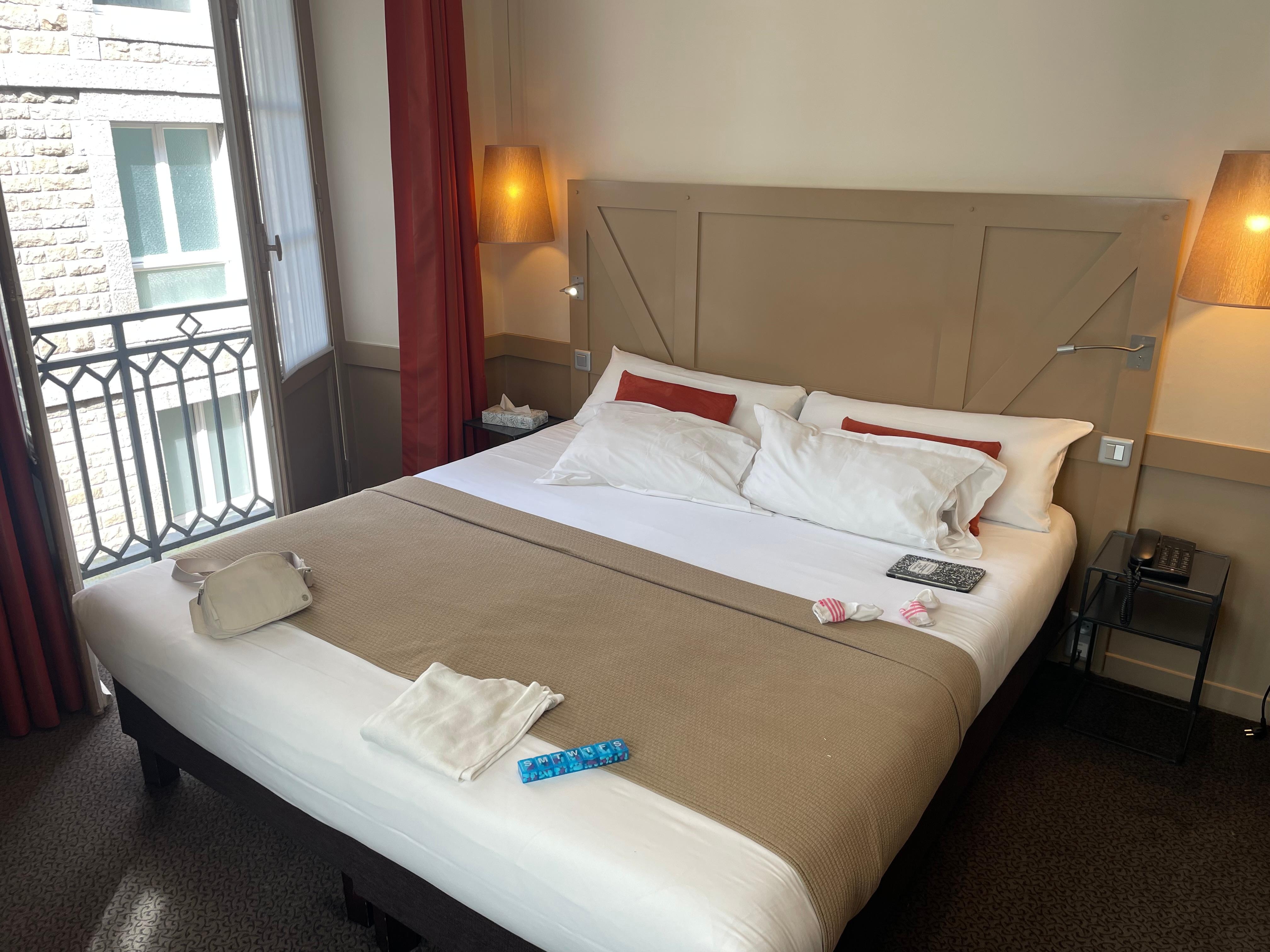A room w three windows, a great bed, and a strong shower