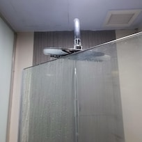 The shower head hits the top of glass door when I opened the door of shower room.