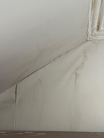 Water damage above/behind wardrobe