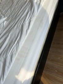 Stained hand prints on mattress topper