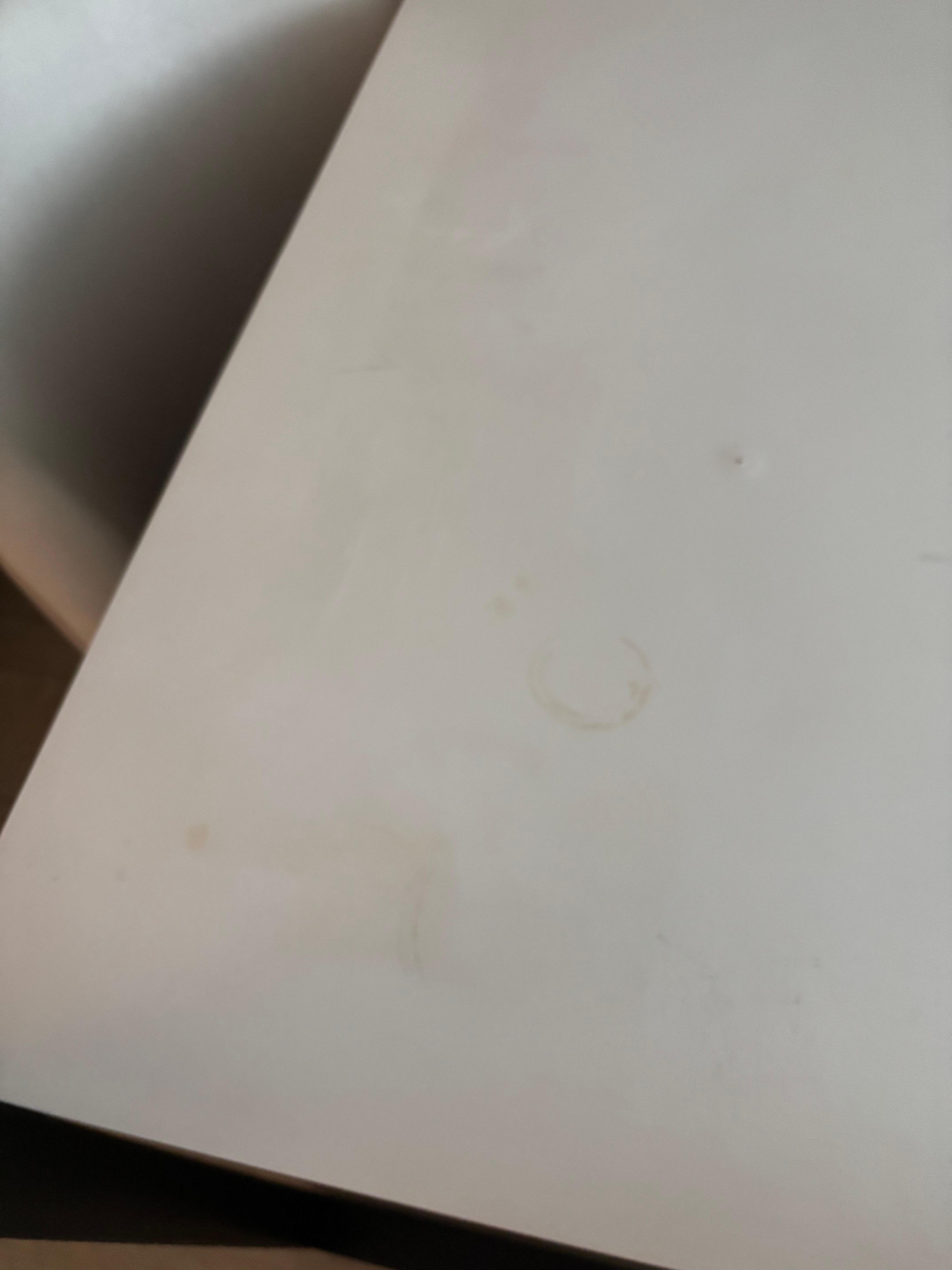 Coffe stains on desk.