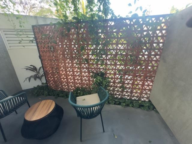 This photo makes the "balcony" look waaaay bigger than it is. Note car on outside