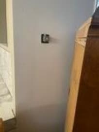 Thermostat behind dresser