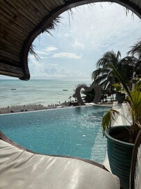Infinity pool with view of the beach