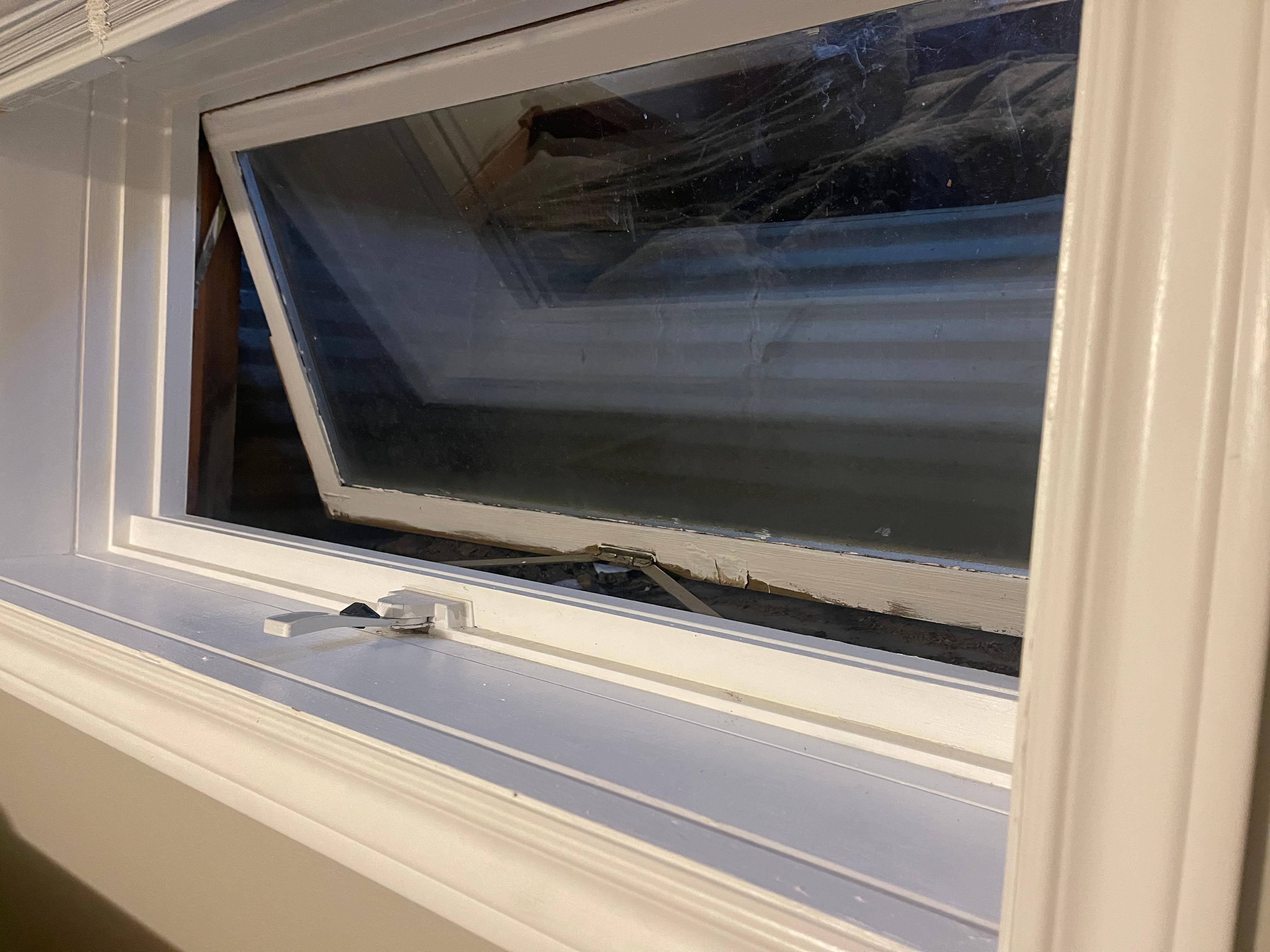 This is a bedroom windows opened that opens into the nailed-shut window wells. 