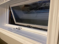 This is a bedroom windows opened that opens into the nailed-shut window wells.