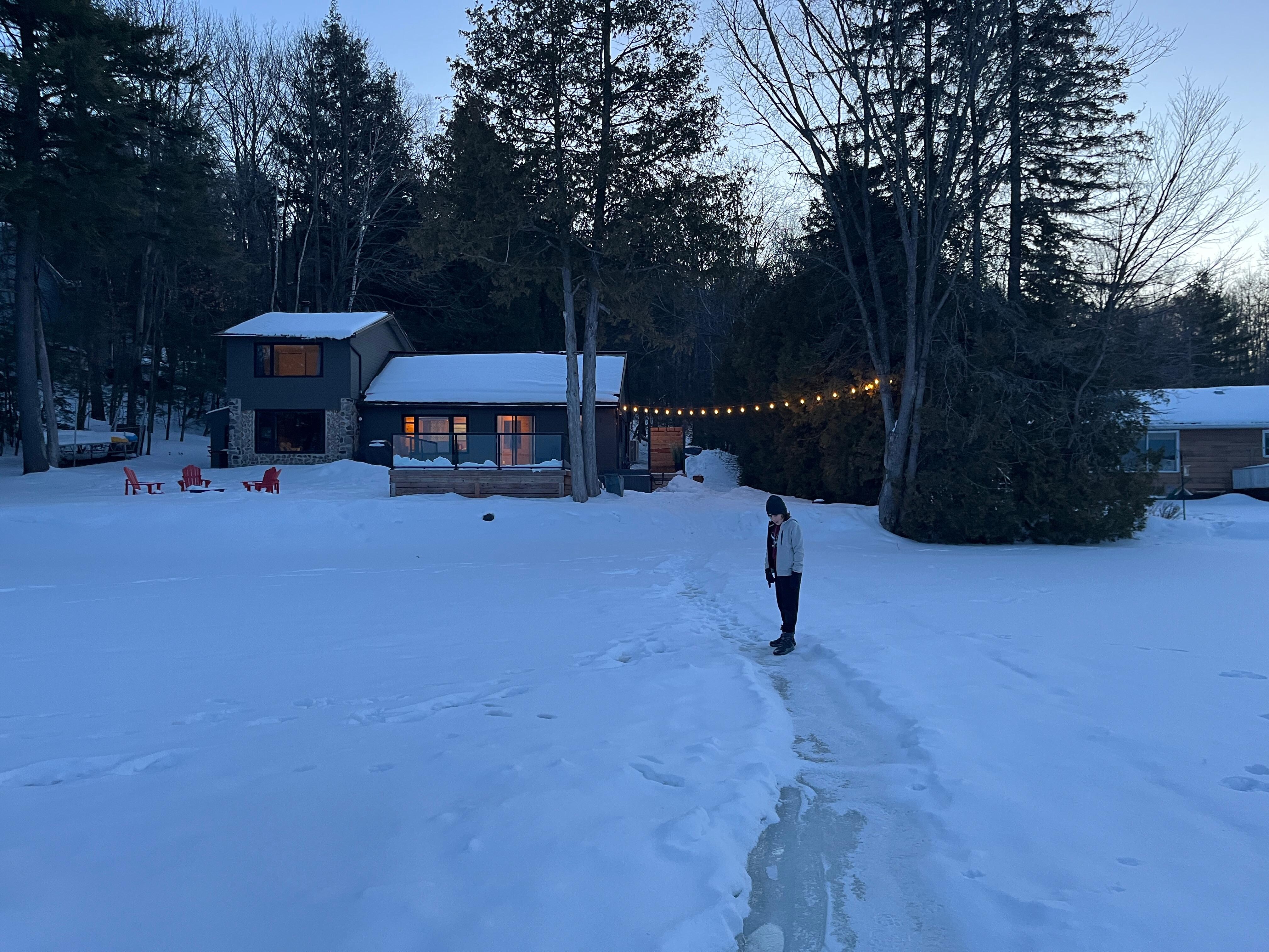 View of the house, standing out on the frozen lake. 