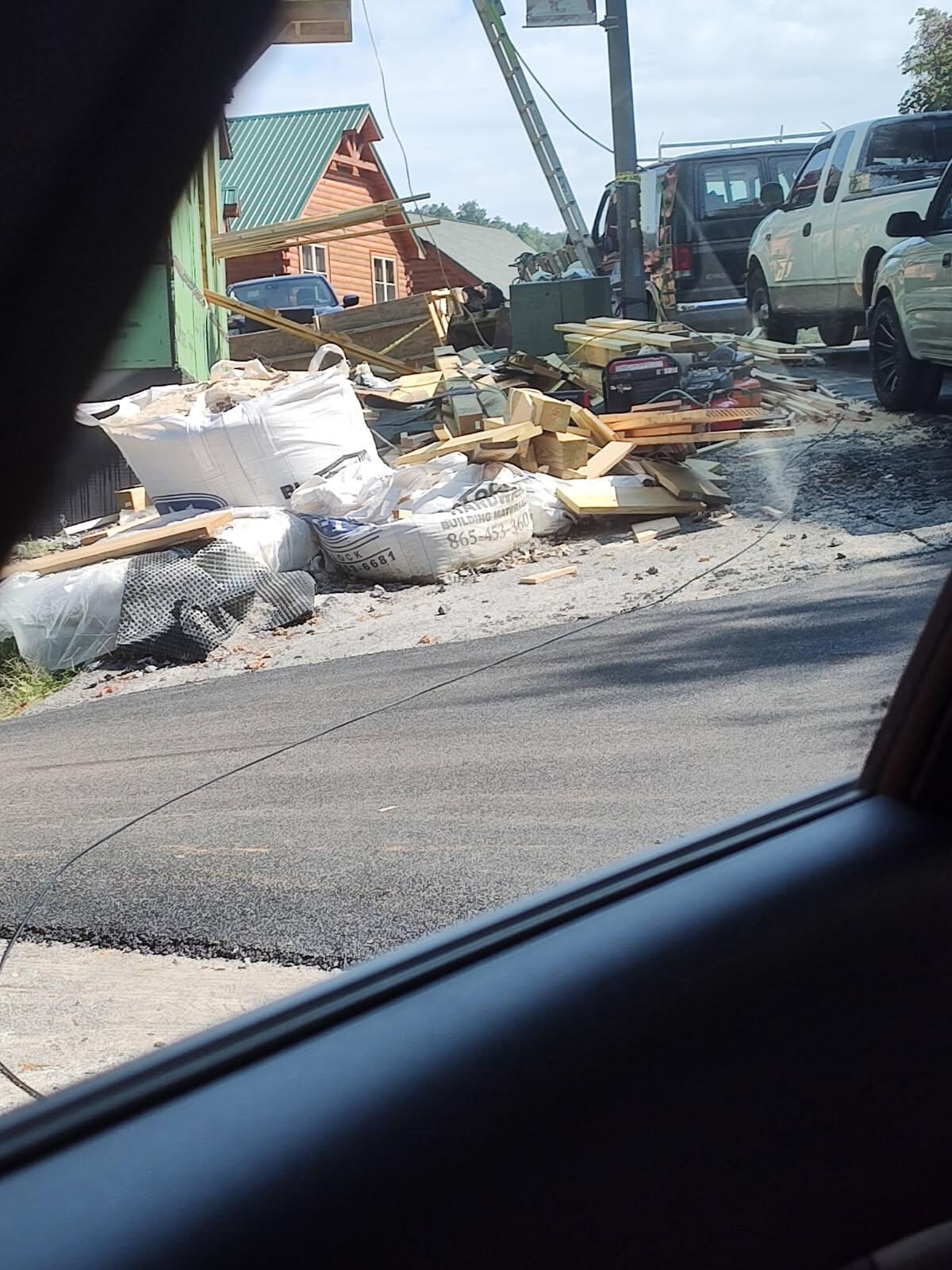 Cable wire left across the road and into construction site.