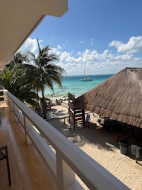 Lovely small patio area in front of our door- with table & 2 chairs
