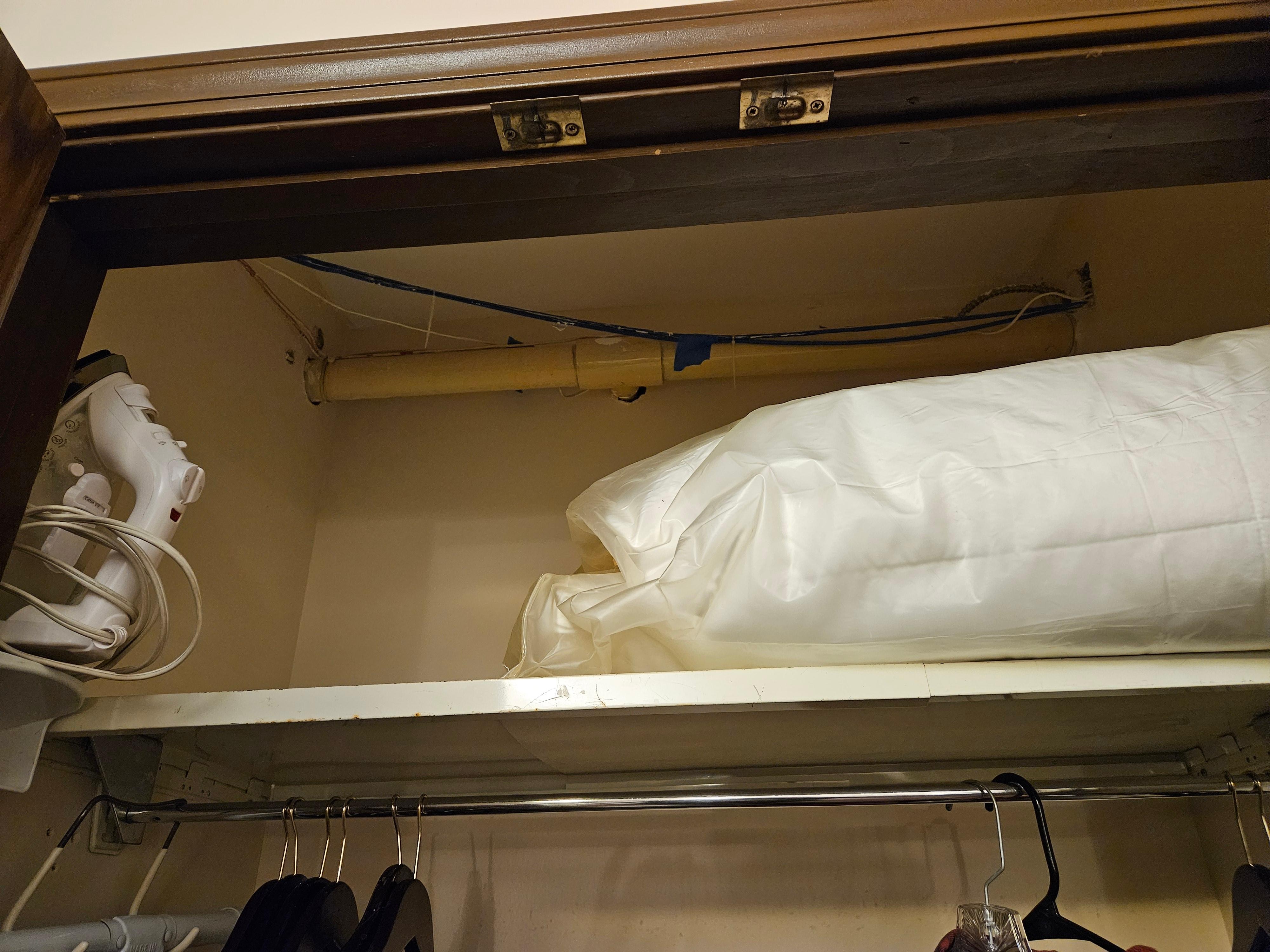 Closet had the plumbing and wiring hanging down