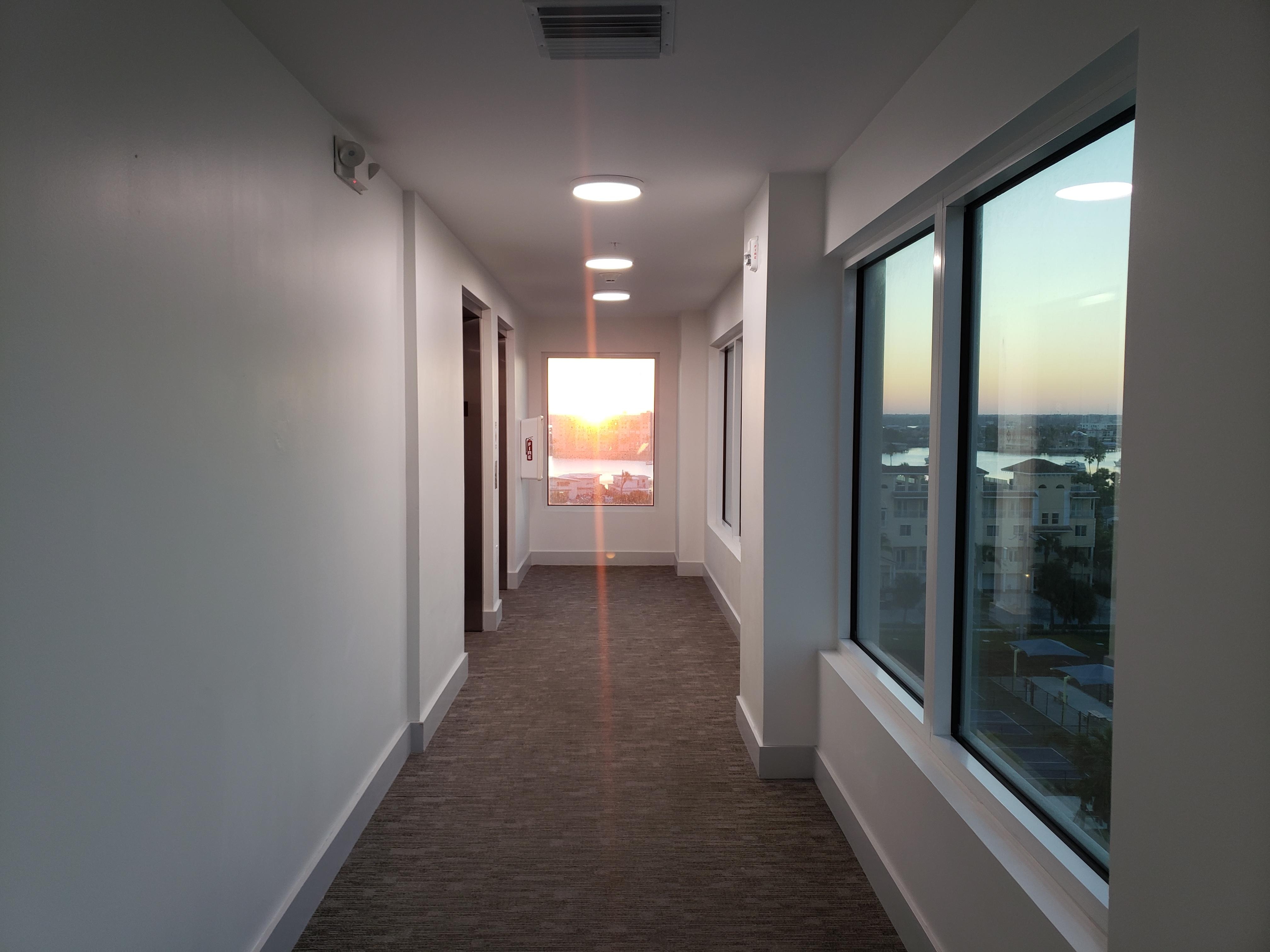 Sunrise down hallway to elevators