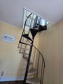Stairwell to the game room; similar set on other side of house to 2 lower bedrooms & full bath. Very sturdy!
