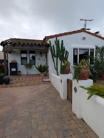 Host's home. The private gate to the casita is to the left, unseen in this photo. You walk through the gate and proceed through a walkway back to the casita.