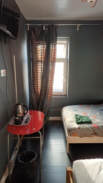 Not the light white painted walls, wardrobe and TV cabinet as advertised