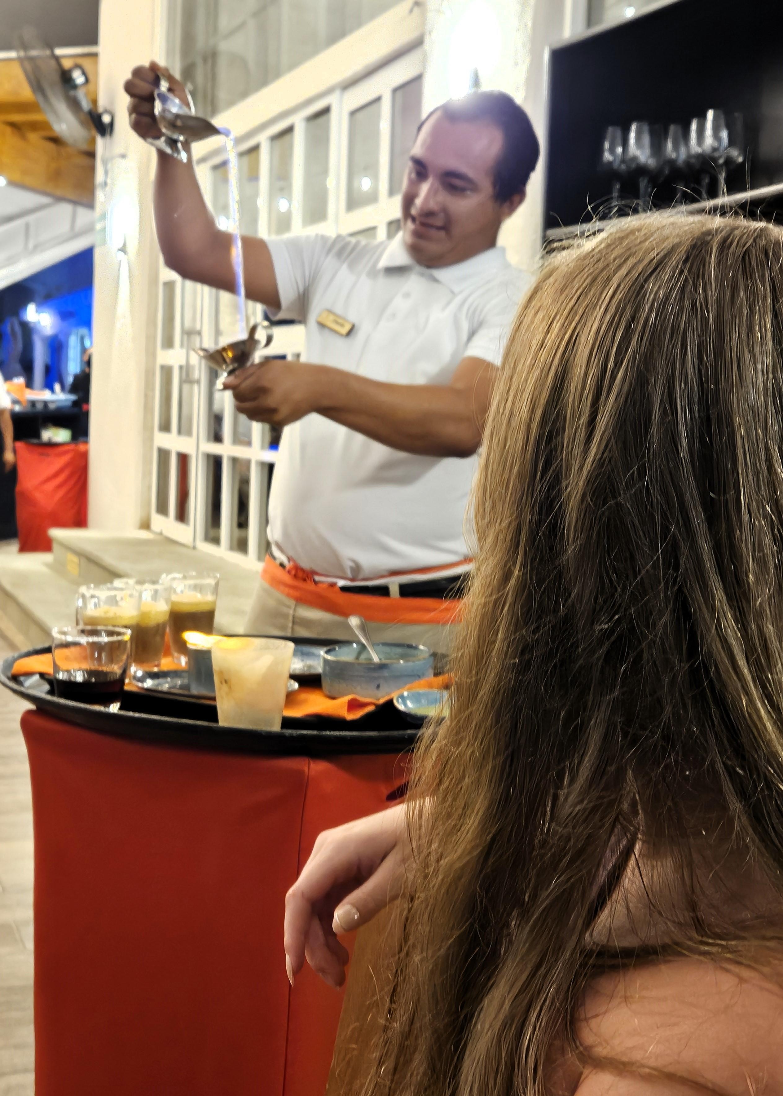 Orlando making Mayan Coffee at table side at Sunset Restaurant! It was AMAZING!! He is such a great waiter!!  