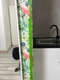 Wallpaper held up using tape