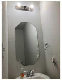 Missing light bulb in bathroom. Also, no exterior light out front