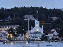 An evening shot of Harborview (to the left of the church) from the Harbor!