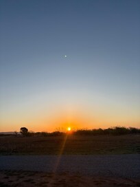 A view of the sunrise from outside the cabin.