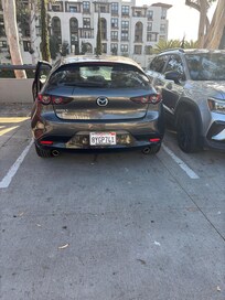 Our massive Mazda parked in the parking lot of hotel.