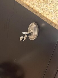 Toilet paper holder fully broken off.