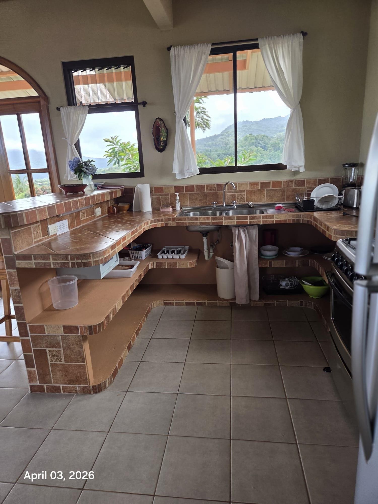 The upstairs bedroom view of the kitchen