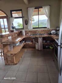 The upstairs bedroom view of the kitchen