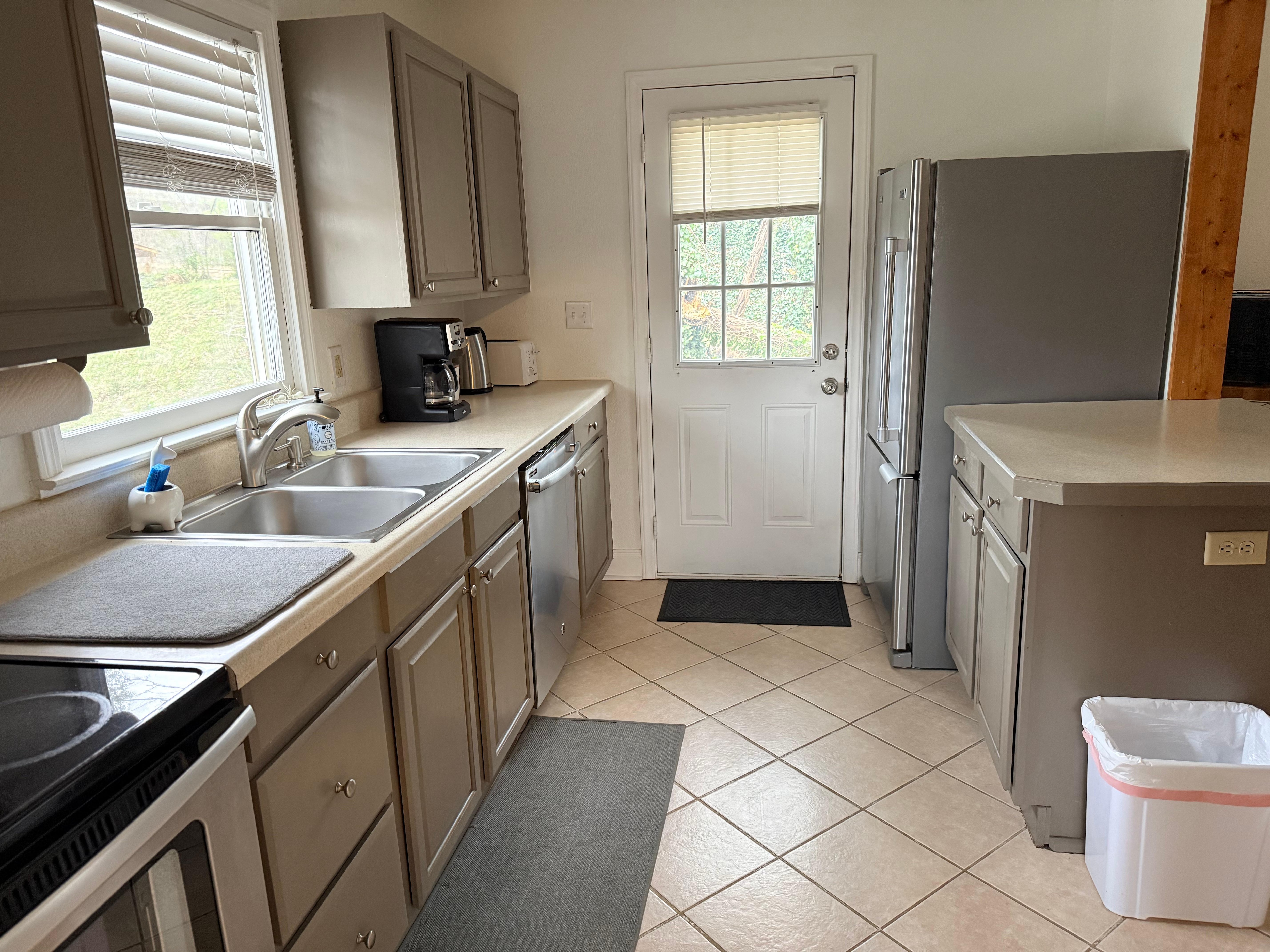 Kitchen - door goes to back yard (short fence, steep hill takes up half of the yard - I forgot to get a picture)