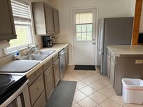 Kitchen - door goes to back yard (short fence, steep hill takes up half of the yard - I forgot to get a picture)